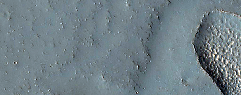 Dark Spot/Depression in the Phlegra Region 