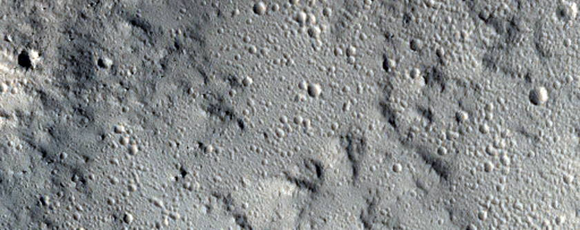 Impact Crater and Possible Related Lava Tube Collapse Features