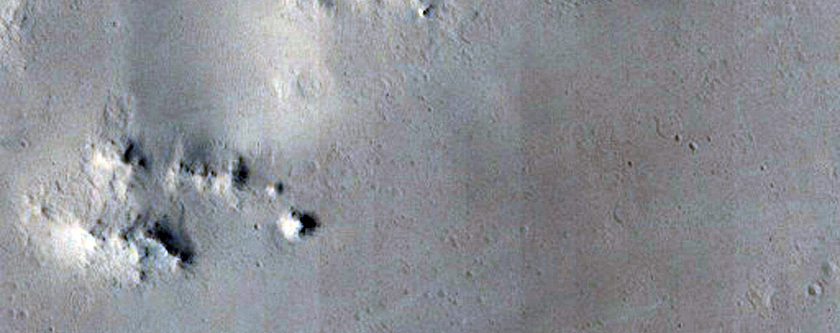Relatively Large Primary Crater on Elysiu Planitia Young Lavas