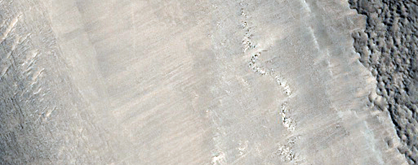 Textured Material and Weird Ejecta on Floor of Mamers Valles