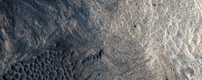 Crater in Layered Deposits of West Candor Chasma