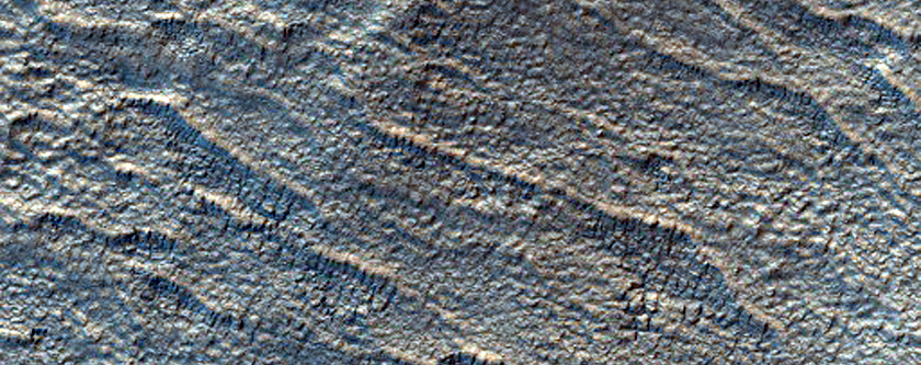 Dark Materials on the Ejecta of an Unnamed Crater on Floor of Hellas Basin