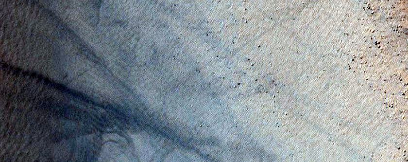 Small Crater in Aonia Planum