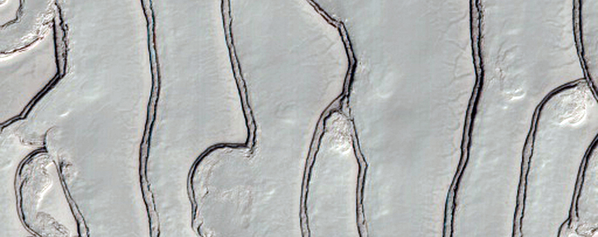 Fingerprint Terrain with Sawtooth Patterns in the South Polar Ice Cap