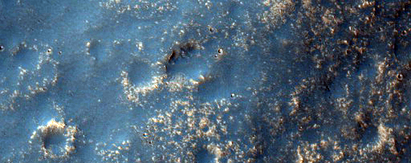 Circular Feature Surrounding Mesa South of Tharsis Region