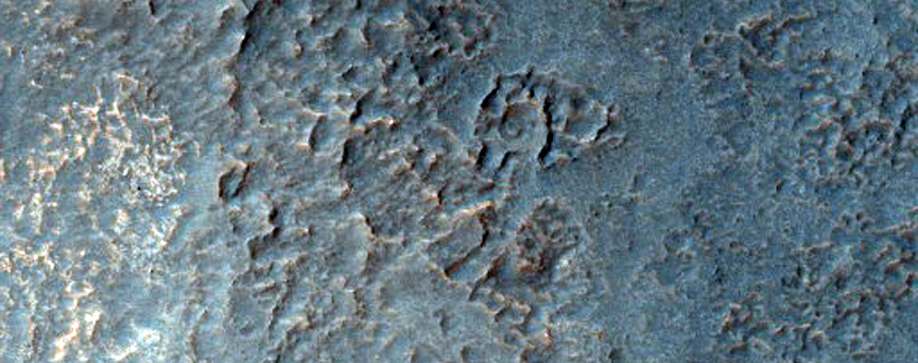 Pit on Crater Floor Exposing Layered Deposits