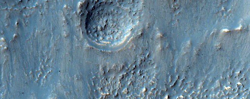 Layered and Degraded Mantling Material on Crater Rim in Noachis Terra