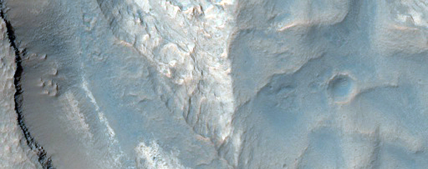 Pit with Well-Exposed Layered Bedrock North of Hellas Region