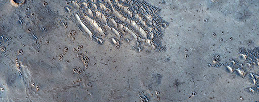 Small Bright-Ejecta Crater Clusters West of Zunil Crater