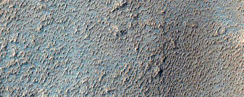 Sharp Albedo Boundary and Blunt Valley Headwall in Syria Planum