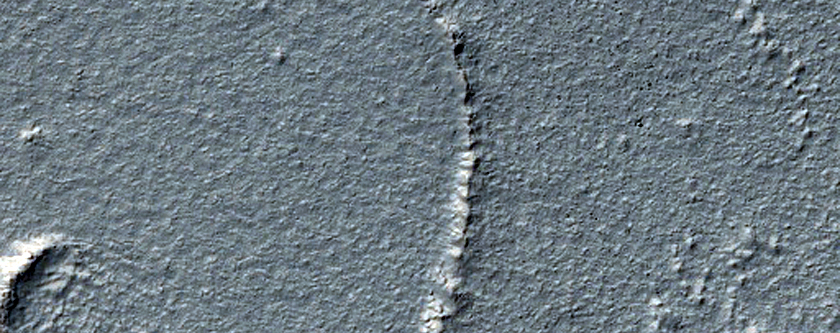 Mantled Crater in Promethei Terra