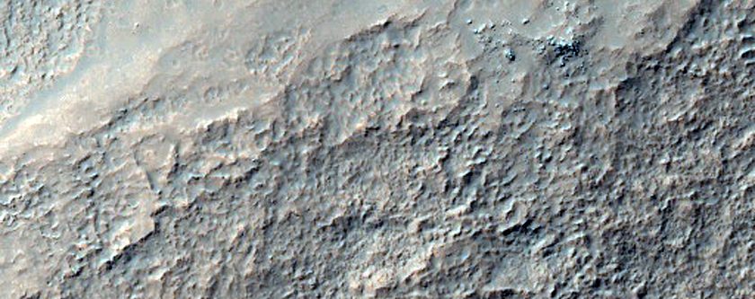 Deeply-Incised Channels in Mantled Crater Walls
