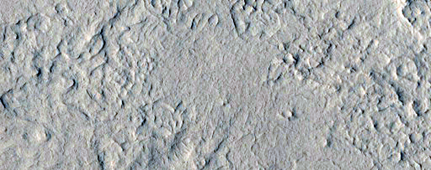 Layering and Slope Streaks in Henry Crater