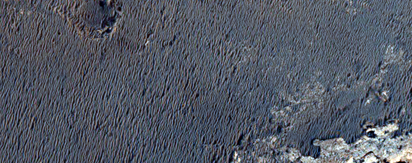 Crater at Layered Rock Boundary in Sinus Meridiani