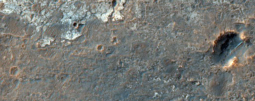 Light-Toned Outcrops in Plains Between Melas and Candor Regions