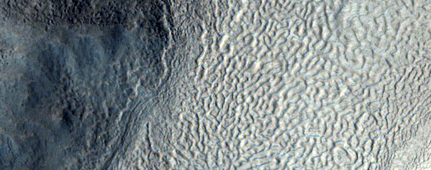 Lineated Valley Flow and Dissected Mantle Terrain in Chaotic Region