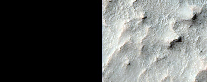 Layered Sedimentary Rocks of Floor of Large Crater