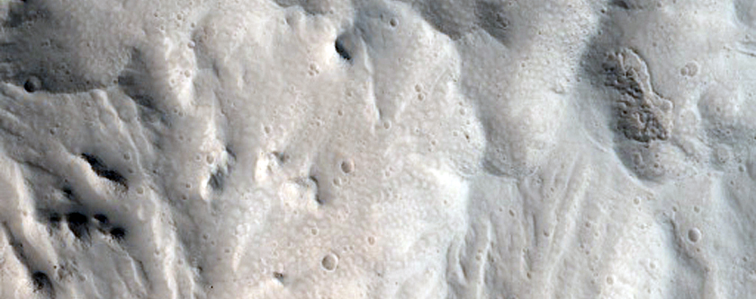 Well-Preserved Impact Crater on Alba Patera