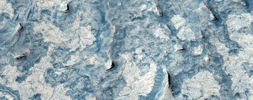 Rock Outcrops and Dark-Toned Bedforms Seen in MOC Image FHA-00541
