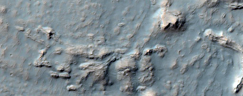 Gullies on South-Facing Wall of Crater Which Are Cutting Debris Mantle