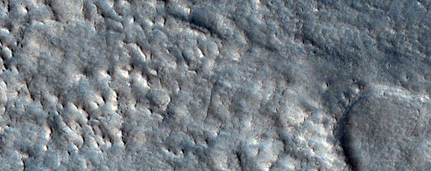 Relation of Lyot Crater Ejecta to Mesas of Deuteronilus Mensae
