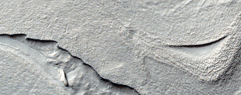 Flow-Banded Deformed Terrain of Hellas Basin Floor