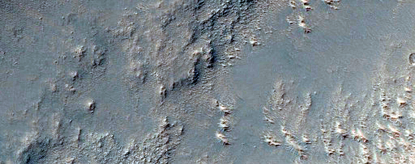 Light-Toned Surface in Rugged Terrain North of Icaria Planum