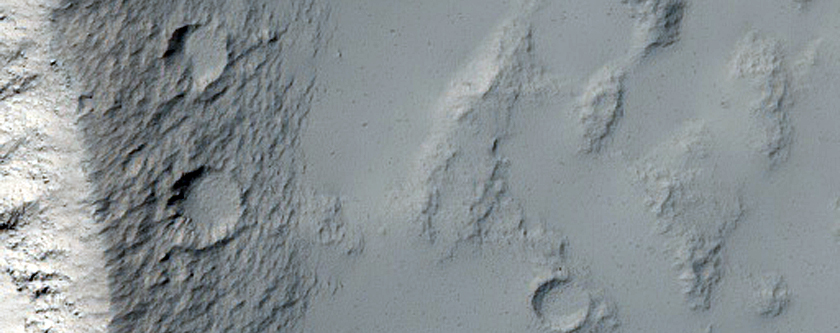 Windblown Sediment Distribution Around Crater in Daedalia Planum
