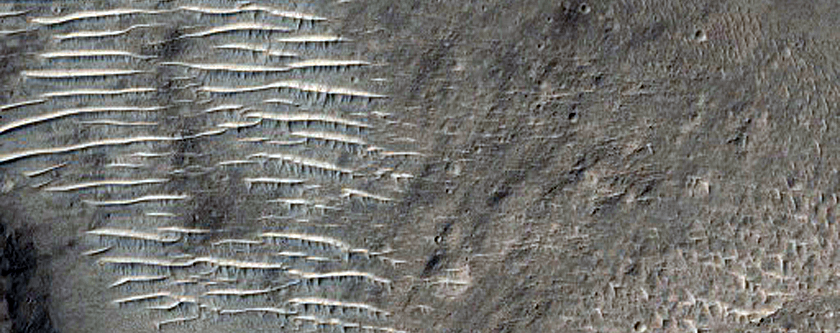 Crater with Valleys Cut into Its Present Floor