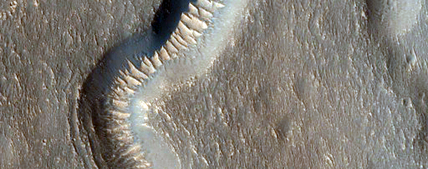 Valley Junction and Light-Toned Bedforms Seen in MOC Image M13-00983