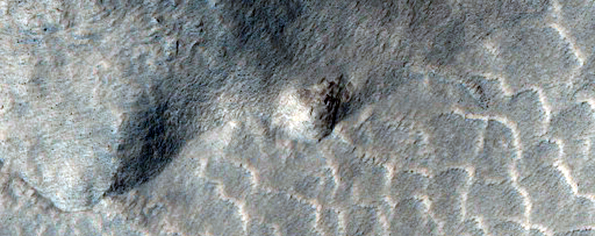 Relation of Lyot Crater Ejecta to Mesas of Deuteronilus Mensae