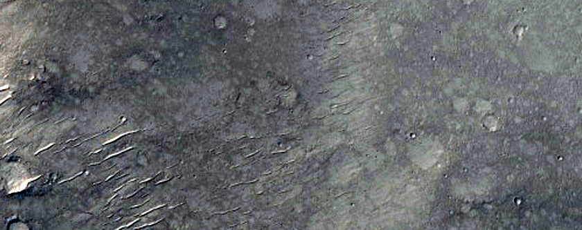 Breach in Gusev Crater and Possible Conduit