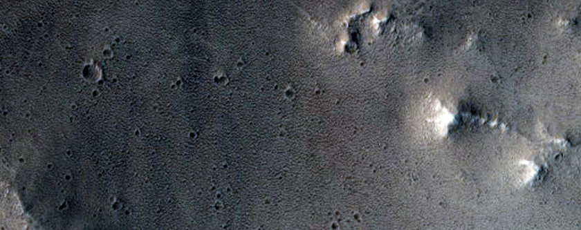 Recent 8-Kilometer Diameter Impact Crater Northwest of Ceraunius Tholus