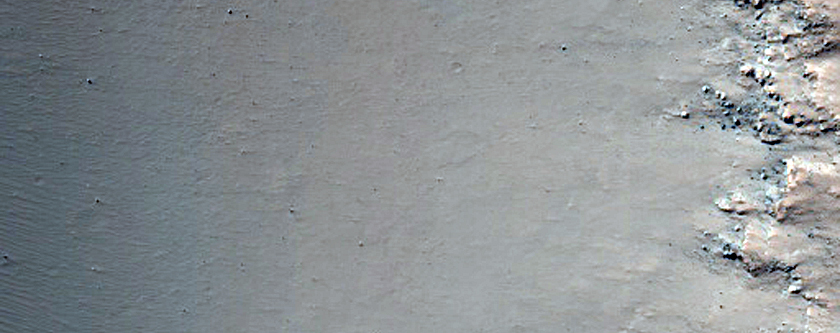Sinuous Channels with Rocky Floor