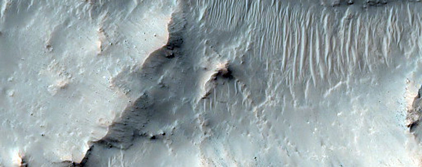 Ponded Materials and Central Pit-Peak of Unnamed Crater Near Denning Crater