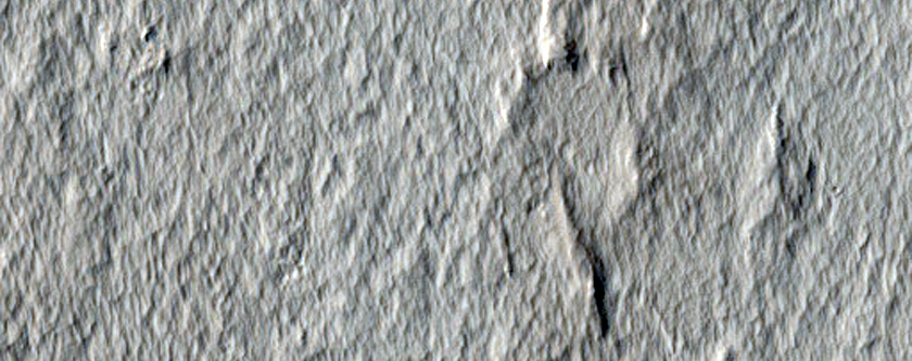 Interaction between Unnamed Crater Ejecta and Pre-Existing Terrain