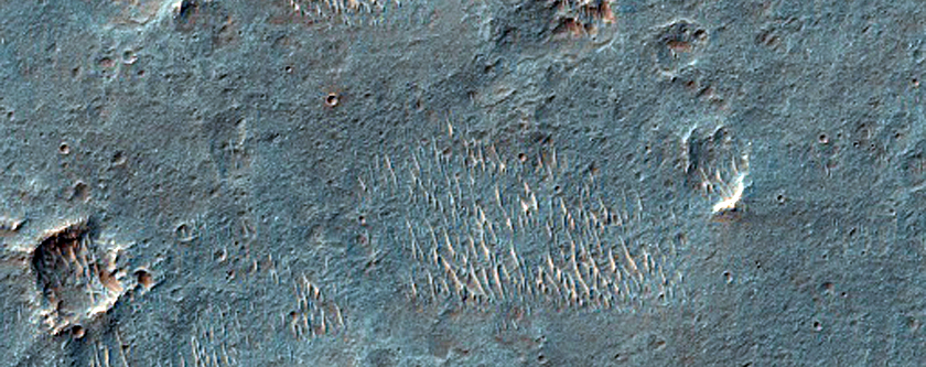 Possible Flow Remnant on Capri Chasma Rim