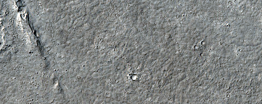 Lava Flow Front and Many Zunil Crater Secondaries on Two Terrains
