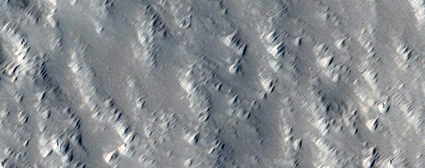 Flat-Floored Depression on North Flank of Hecates Tholus