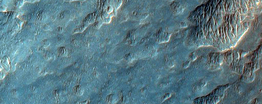 Possible Light-Toned Deposits and Inverted Streams West of Juventae Chasma