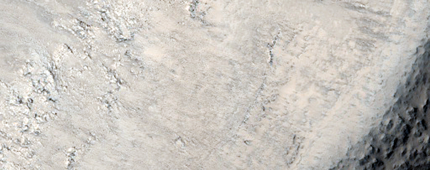 Crater Exposing Layered Stratigraphy of Northern Plains