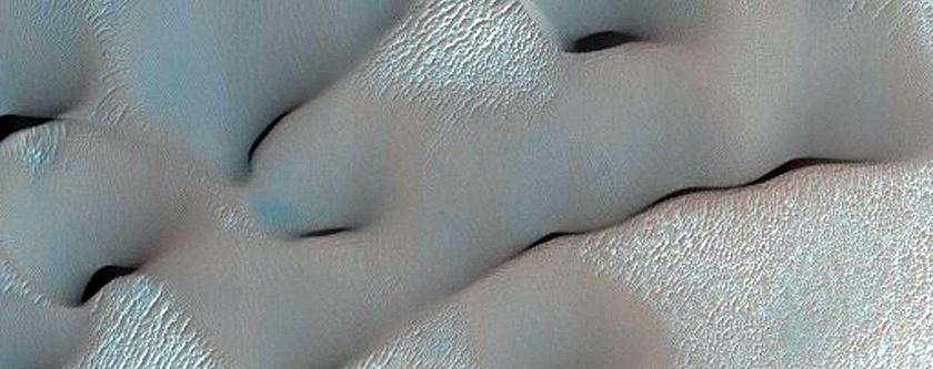 Stratigraphy Beneath Meridiani Planum Exposed in Crater Wall