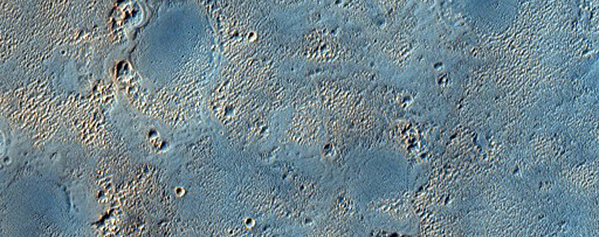 Light-Toned Unit Being Exhumed from Overlying Mantle in Arabia Terra