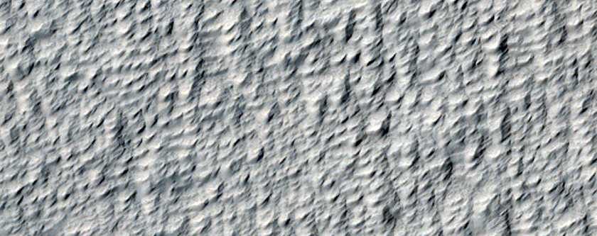 Dark Spot in Smooth Facies North of Pavonis Mons