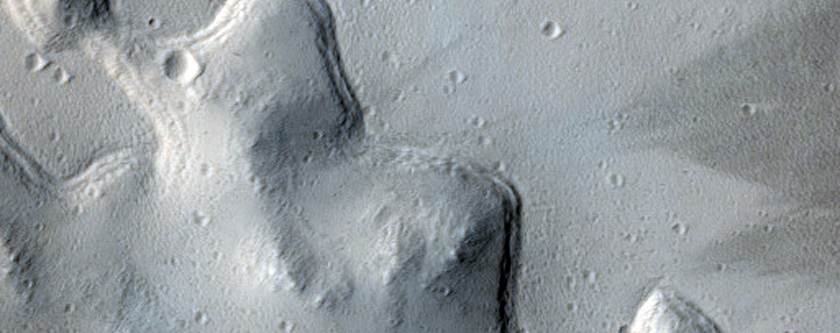 Smooth Crater Floor with Bounding Terrace on Flank of Uranius Mons