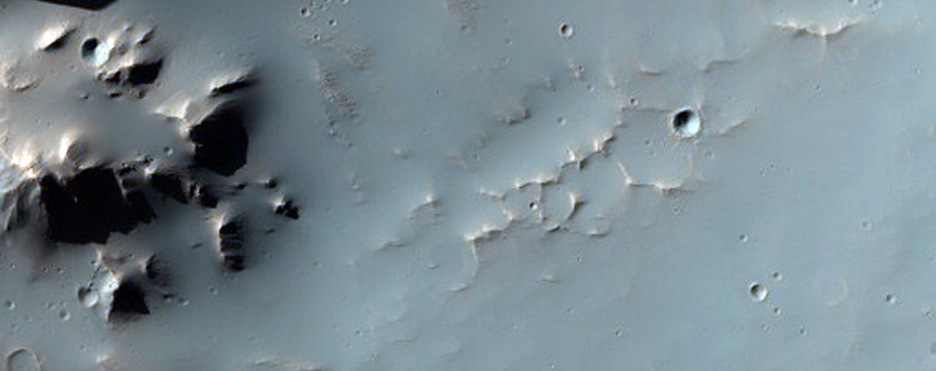 Well-Preserved Crater on a Steep Slope in Tyrrhena Terra