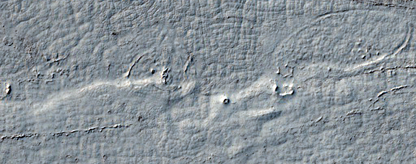 Fluvial Processes Near the Head of Lethe Vallis