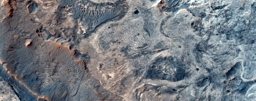 Exhumed Impact Crater in Layered Deposits