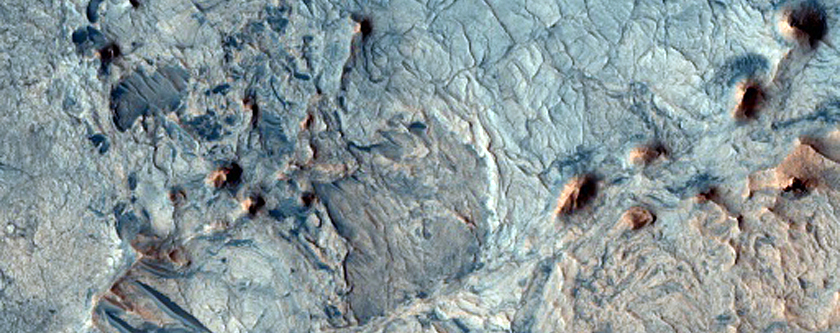 Layers with Iron Magnesium Phyllosilicate on Crater Floor