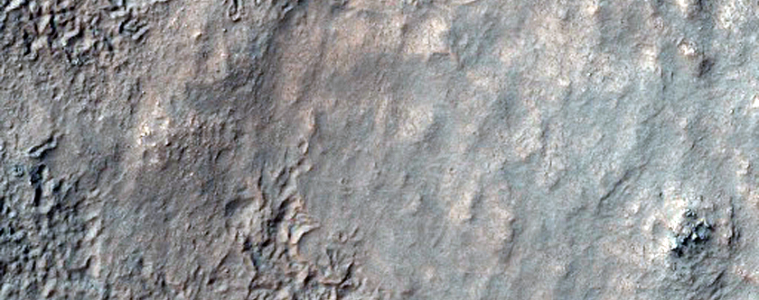 Exposures of Layered Bedrock North of Hellas Basin